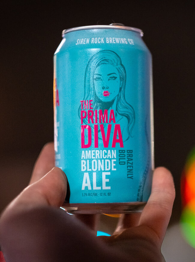 someone holding a can of The Prima Diva